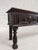 A late 17th-century solid English oak console, circa 1680, with a rich dark brown patina. The long, shallow form has a...
