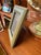 A vintage Italian picture frame wrapped in supple olive green leather with fine contrast stitching and a softly padded...