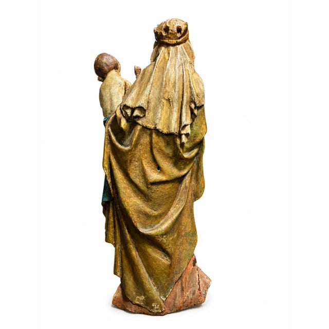 Layers of aged gilding and polychrome paint give this carved Madonna and Child a warm, softly glowing surface with real...