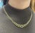 This 14K Gold Graduated Curb Chain Necklace with lobster closure. The necklace features a graduated chain design, with the...
