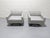 Poltona Frau, Kennedde swivel armchairs designed by Jean-Marie Massud. Known for the contrasting hand stitched x across...