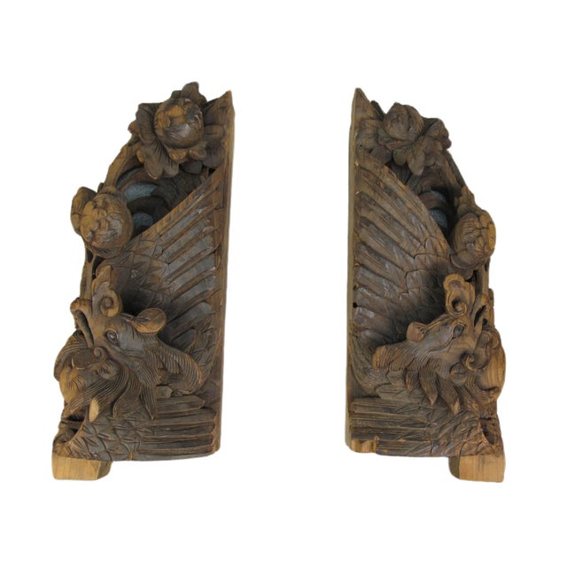 This pair of antique carvings from mid 19th century China are handcrafted from fine wood and feature intricate details and...