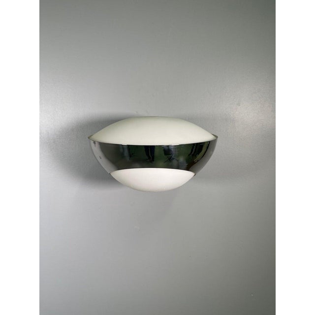 A rare pair of nickel wall lamps designed by Max Ingrand for Fontana Arte, model "1963" (Italy). Nickel-plated brass and...