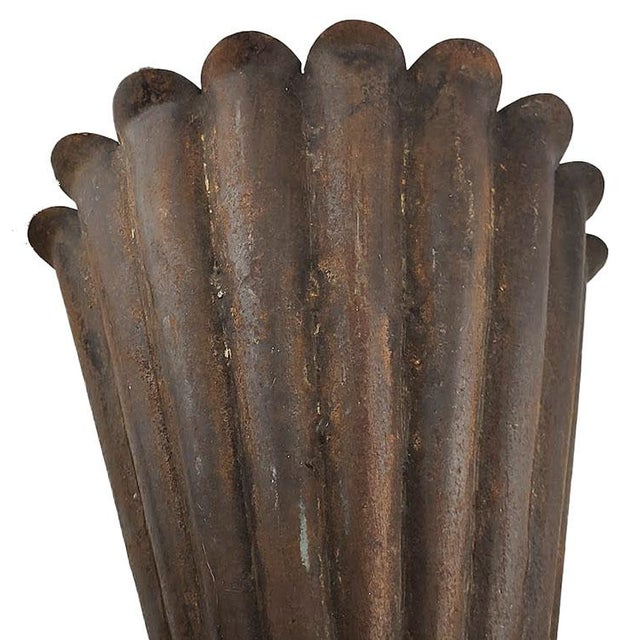 Very cool pair of metal fluted sconces with a shabby chic or farmhouse appeal. The slightly rusty finish offers a two...