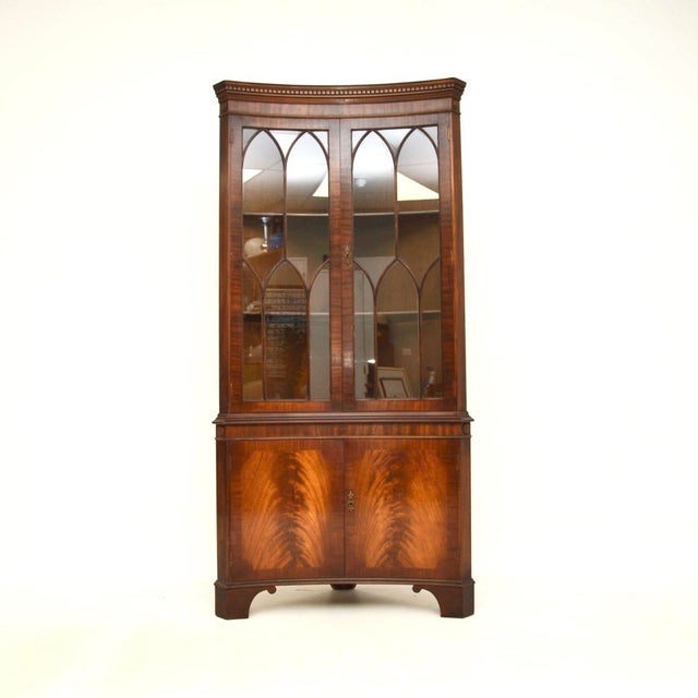 A very impressive antique Georgian style concave corner cabinet. This was made in England, we would date it to around the...