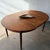 A sculptural carved bowl by American craftsman Emil Milan, made from Bissilon, a rare West African mahogany, and inset...