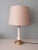 Impressive lamp with white ceramic and brass base and fixture. The lamp has an cream shade, 1 E 27 fitting and a on and...