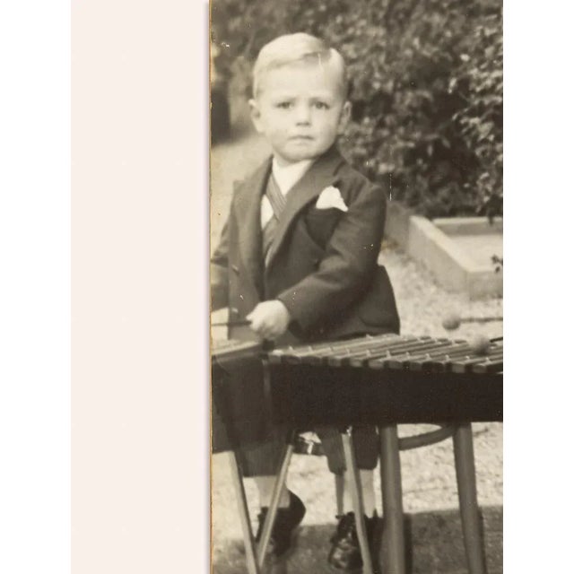 Photographic black and white recording drumming children in the backyard of the Zurich workshop by Eugen Giannini on a...