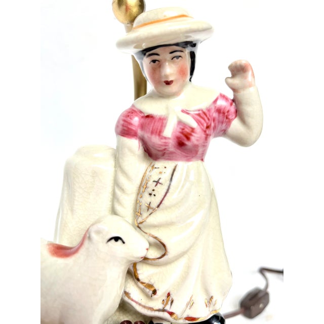 Staffordshire charm. Hand painted figurines. Pastoral scene of country girl with her lamb. Great attention to detail from...