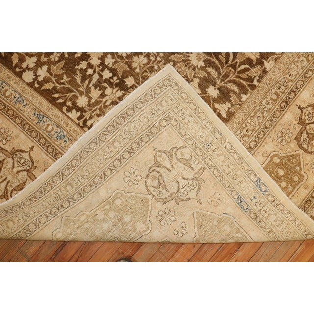 Rare large square size early 20th century authentic Persian Tabriz featuring an all over floral pattern in brown and ivory...