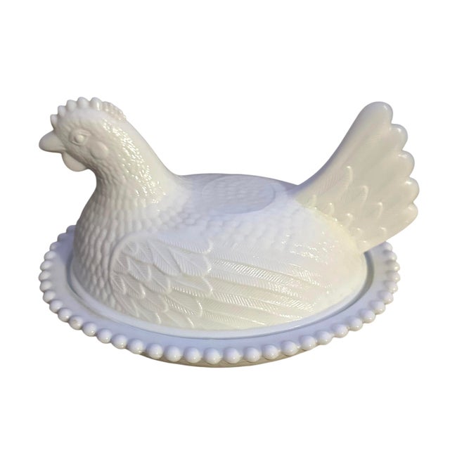 Vintage Indiana Glass White Milk Glass Hen on Nest Covered Dish. Made of pressed glass and features a beaded edge around...