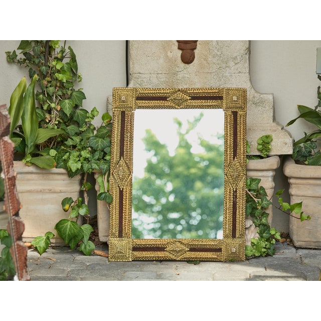 A gilt wood French Tramp Art Folk mirror from the Turn of the Century, with hand-carved raised pyramidal motifs....