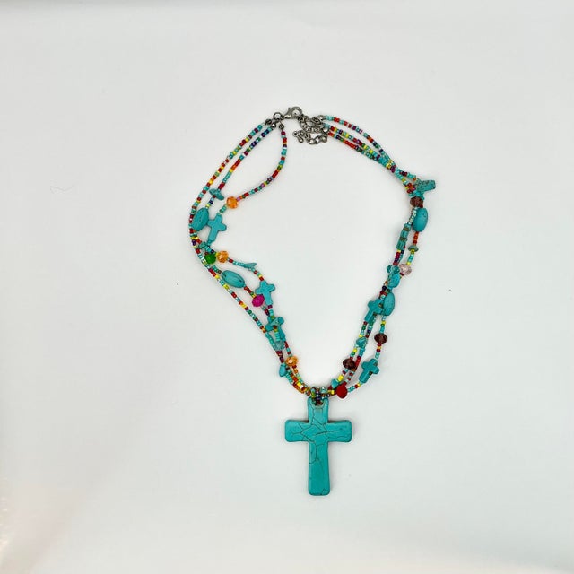This stunning faux Turquoise Cross Pennant Beaded Necklace will become a favorite. It’s styled in the manner of Ralph...