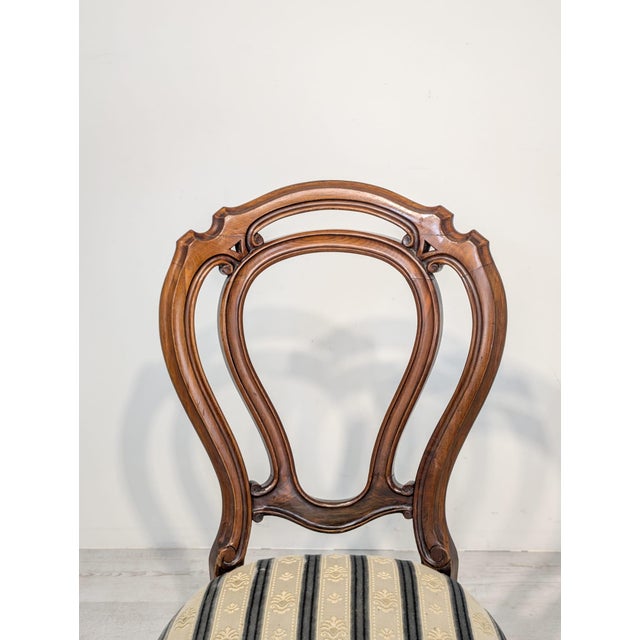 Louis Philippe Medallion Walnut Chair Stylish, wooden Louis Philippe armchair with a medallion backrest. Crafted from dark...