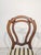 Louis Philippe Medallion Walnut Chair Stylish, wooden Louis Philippe armchair with a medallion backrest. Crafted from dark...