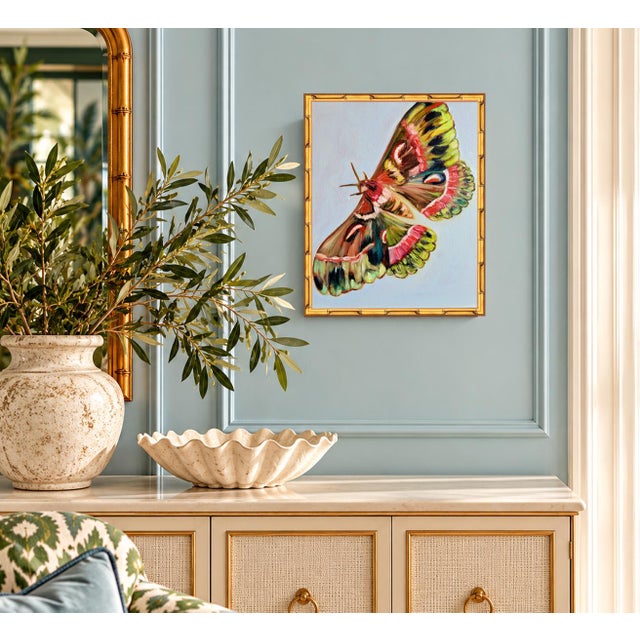 A framed original oil painting by Tatiana Duperault. A large moth with outspread wings is painted in watermelon pink,...
