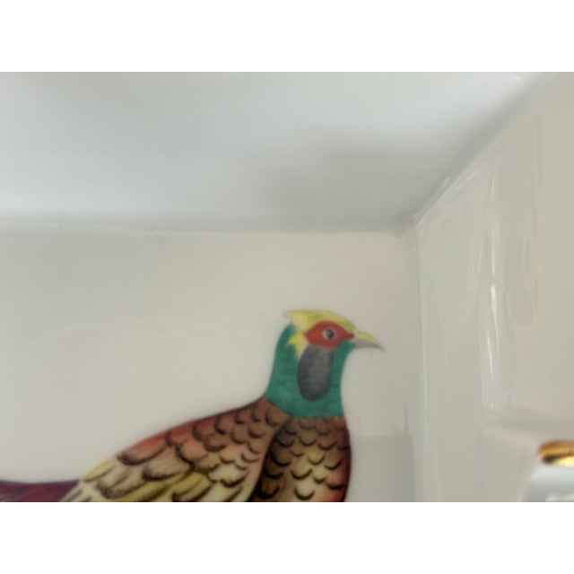 Hermès ashtray in Limoges porcelain. Pheasant motif with a finely gold-painted rim. Marked "Hermès Paris" on one side and...