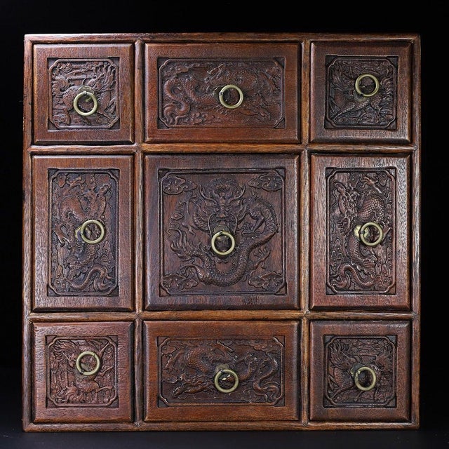 A beautifully crafted Chinese square box, likely made of Huali (rosewood). The piece features a nine-grid configuration...
