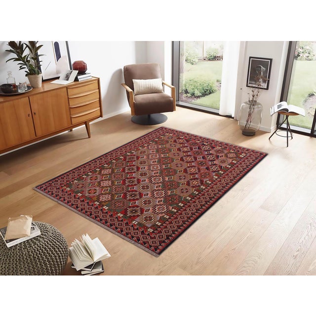 Experience the exceptional craftsmanship of this breathtaking Soumak rug, expertly created by skilled master weavers. Made...