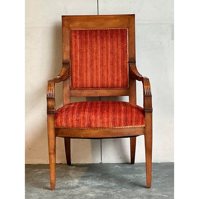 This elegant armchair is a superb example of the refined and formal design of the Regency and Empire periods. Its stately...