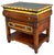 An exceptional vintage GuildMaster accent chest featuring warm wood tones, hand-painted gold trim, and a green leather...