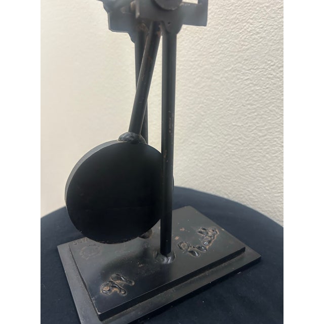 A vibrant and playful kinetic sculpture by renowned American artist Frederick Prescott. Crafted in painted steel, this...