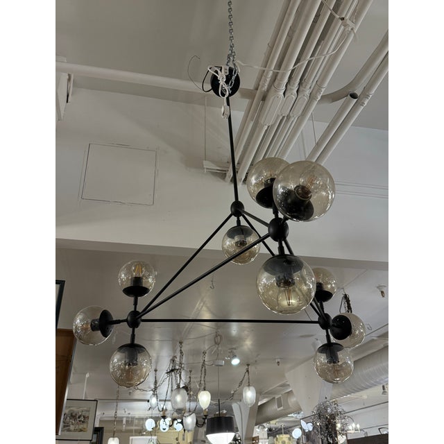 Design Plus Gallery presents the Gable 10-Light Modern Chandelier from Possini Euro Design. This Mid-Century Modern...