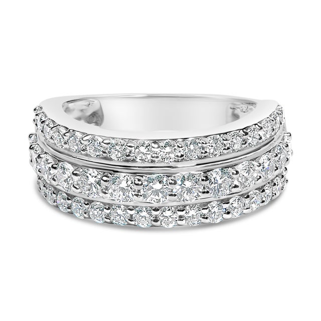 Embrace the sparkle and modern elegance of this exquisite .925 sterling silver ring, plated with lustrous rhodium for...