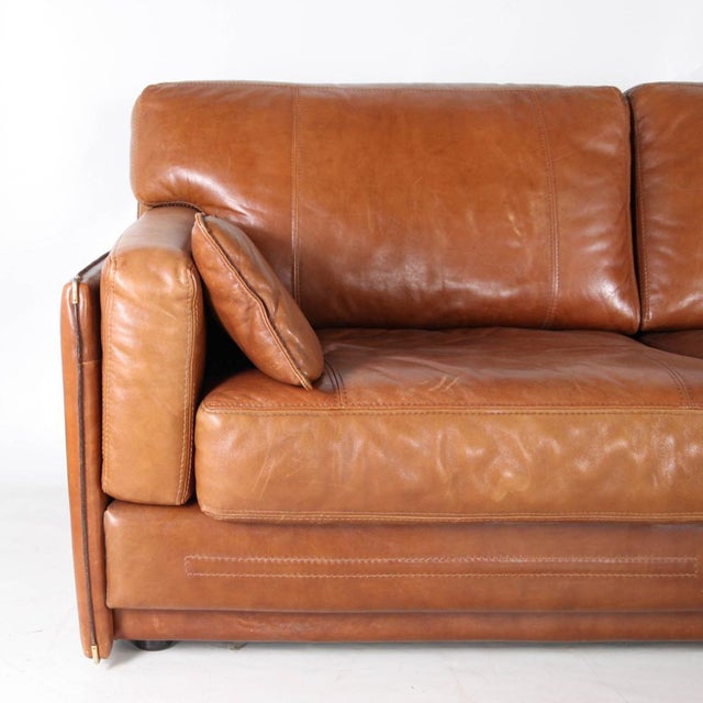 Stunning 3-seater leather sofa produced by Roche Bobois in the 1970s-1980s. Features include saddle stitching, brass...