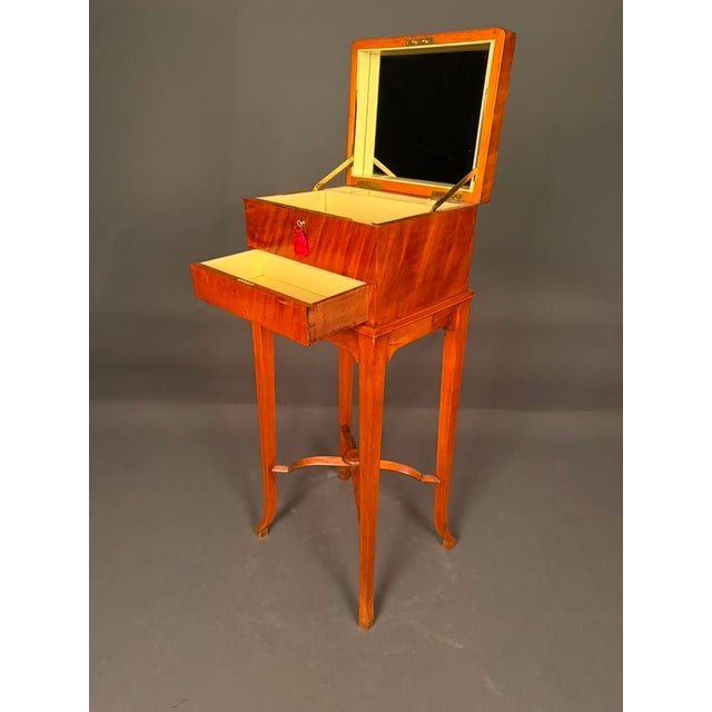 Rare English vanity case on stand in satinwood with mirror, made in England for the French market, circa 1880. This...