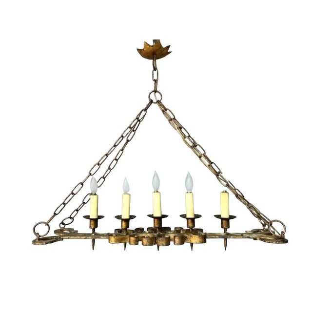 A German entryway chandelier from the 1900s — dramatic Gothic lighting for a castle entry, great room, or lodge. A moody...