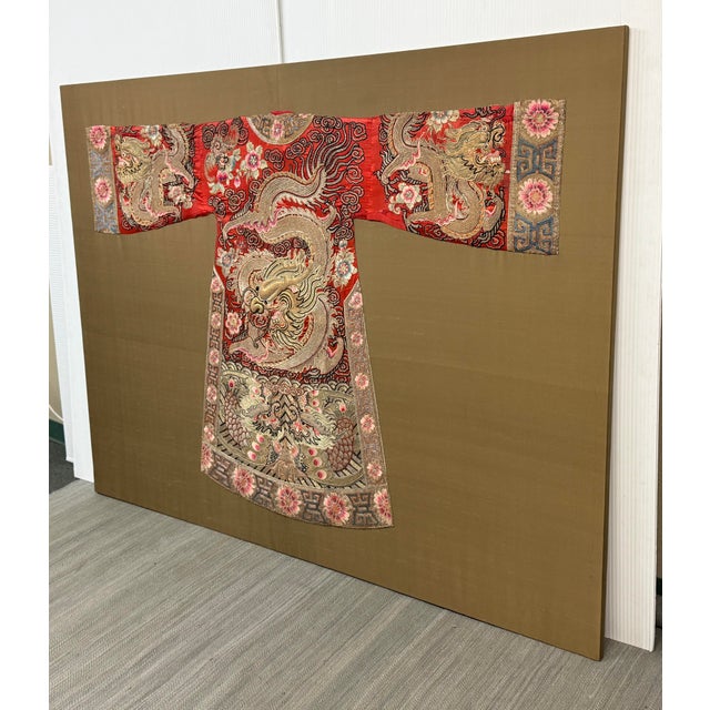 Design Plus Gallery presents a Framed Chinese Theater Dragon Robe from the Late 19th Century, Qing Dynasty. The robe is...