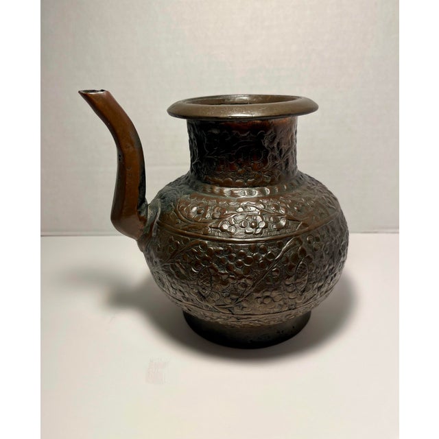 Beautiful antique 19th-century copper kindi, a traditional Hindu holy water vessel used in religious rituals and daily...