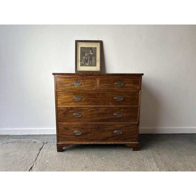 An early Victorian mahogany large chest of drawers with a warm, even tone and fine grain arranged in a two-over-three...