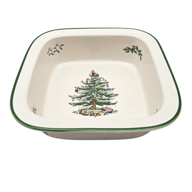 This ceramic square rim dish, framed in green, bears the iconic Spode Christmas Tree, gifts nestled beneath its boughs....