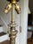 An early-20th-century reverse-painted art glass table lamp attributed to the Pittsburgh Lamp, Brass & Glass Company...