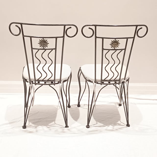 Vintage French Style Wrought Iron Garden Chairs With Sunburst Design. Solid and heavy. Comes with cushions. 18" w x 16"d x...