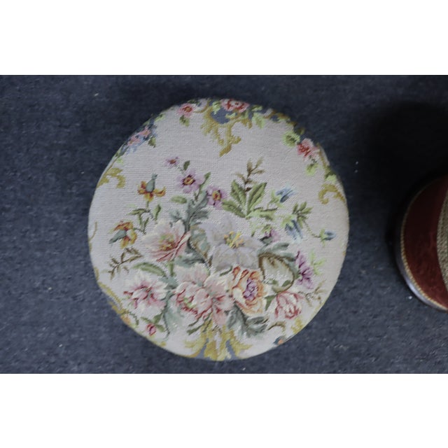 Charming pair of Victorian footstools dating to the late 19th century. Each stool features a finely upholstered...