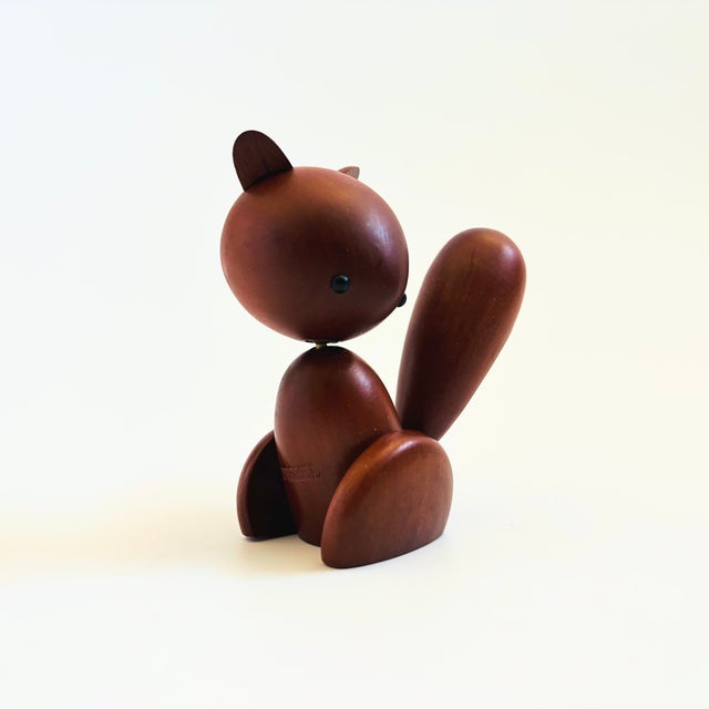A mid century turned wood figurine in the shape of a squirrel. Adorable stylized features. Made in Japan by Senshukai as...