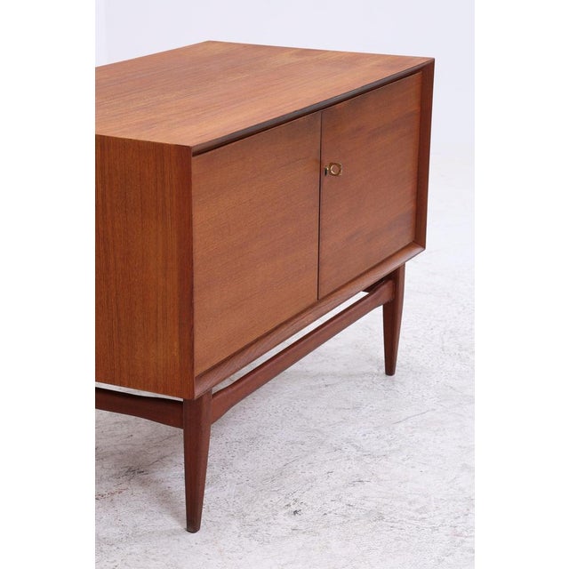 Vintage teak chest of drawers by Heinrich Riestenpatt with beautiful proportions and clean lines. The finely crafted base,...