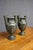 Exceptional pair of Italian Neoclassical bronze Grand Tour urns, each raised on a circular black marble base. The...