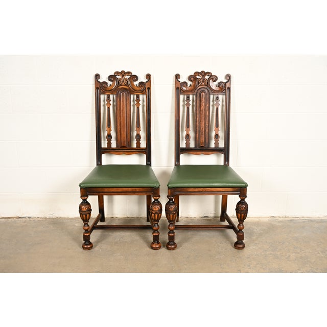 A beautiful pair of antique English Jacobean or Tudor style side chairs or dining chairs By Berkey & Gay USA, Circa 1920s...