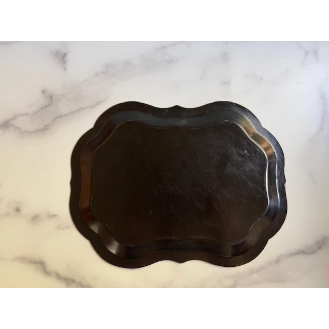 Pretty mid-century Tole tray. Black metal with painted pink and green roses.