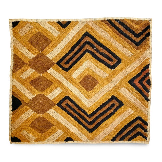 Traditional vintage Kuba grass textile handmade from the indigenous people of the Congo. Bold geometric patterns created...