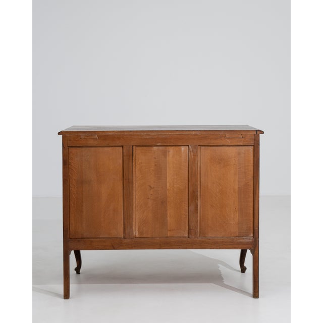 This exquisite chest of drawers captures the graceful spirit of the Louis XV period, rendered in rich wood with the...
