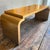 This is a late 20th century waterfall coffee table with a professionally applied gold leaf finish attributed to Dennis and...