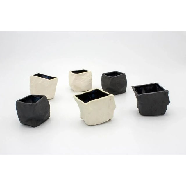 Black and white cups 6-set by Craig Barrow Dimensions: 6 x 5 x 5.5cm Volume approximate: 50ml Variations: Black porcelain,...
