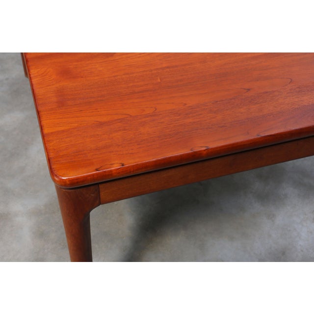 A beautifully crafted Danish extendable dining table, manufactured by Glostrup Møbelfabrik in Denmark around 1965. This...
