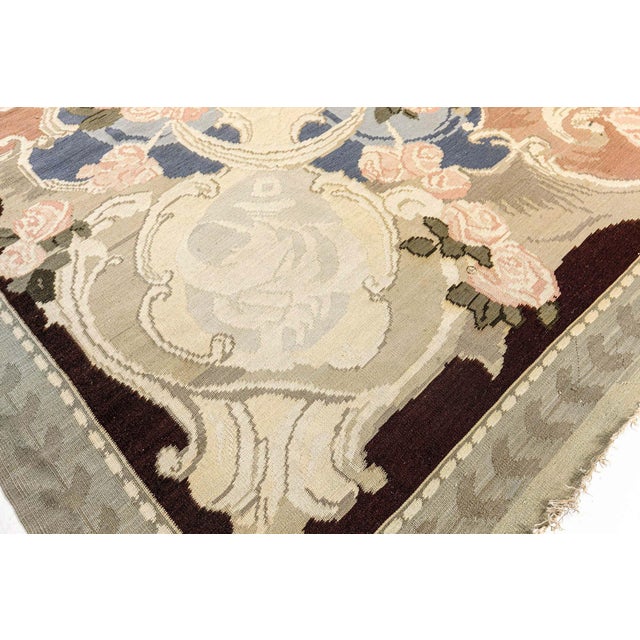 This exquisite 1920s Bessarabian rug captures the poetic elegance of Eastern European textile art at its peak. Handwoven...