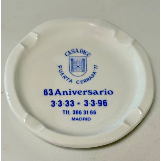 This vintage blue and white ceramic commemorative ashtray/catchall is from the Casa Oaci restaurant located at Puerta...